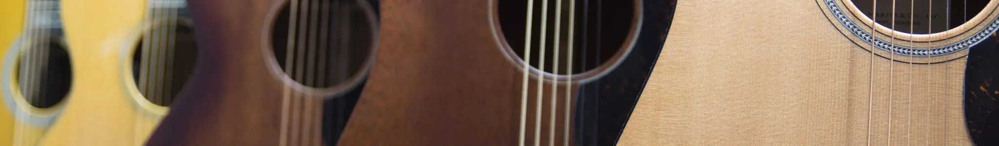 Closeup of guitars on display