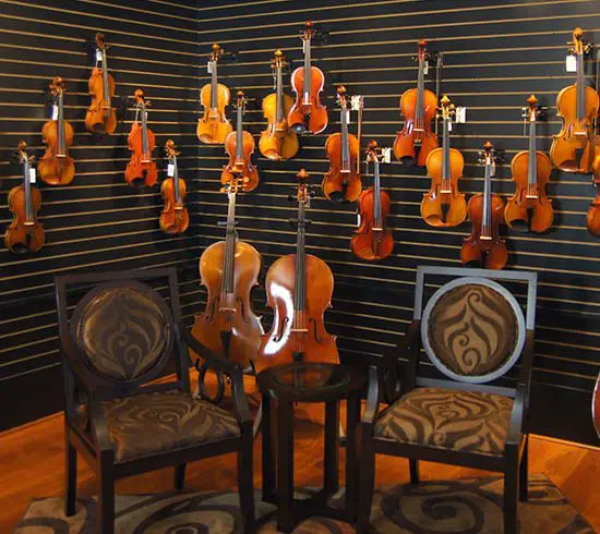 STRING SHOPPE, quick glace, instruments on the wall with two chairs
