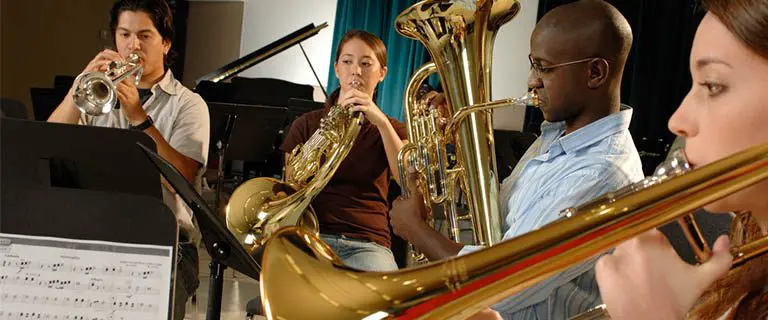 students playing brass instruments in a group