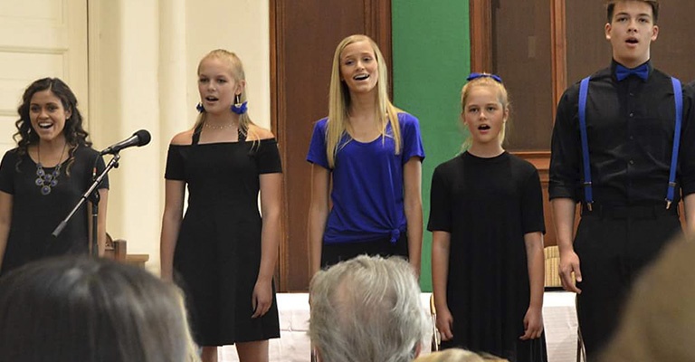 Choir of five people singing together