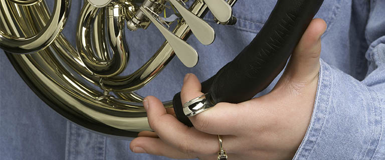 student holding french horn