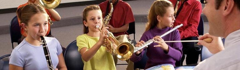 children performing in a school band
