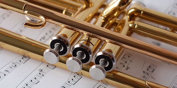 Close up of trumpet on music background